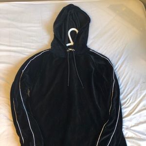 Black hoodie with white stripes on the arms